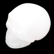 Mangano Calcite skull 32*45*38mm 87g in sunlight - Rocks and Things Store