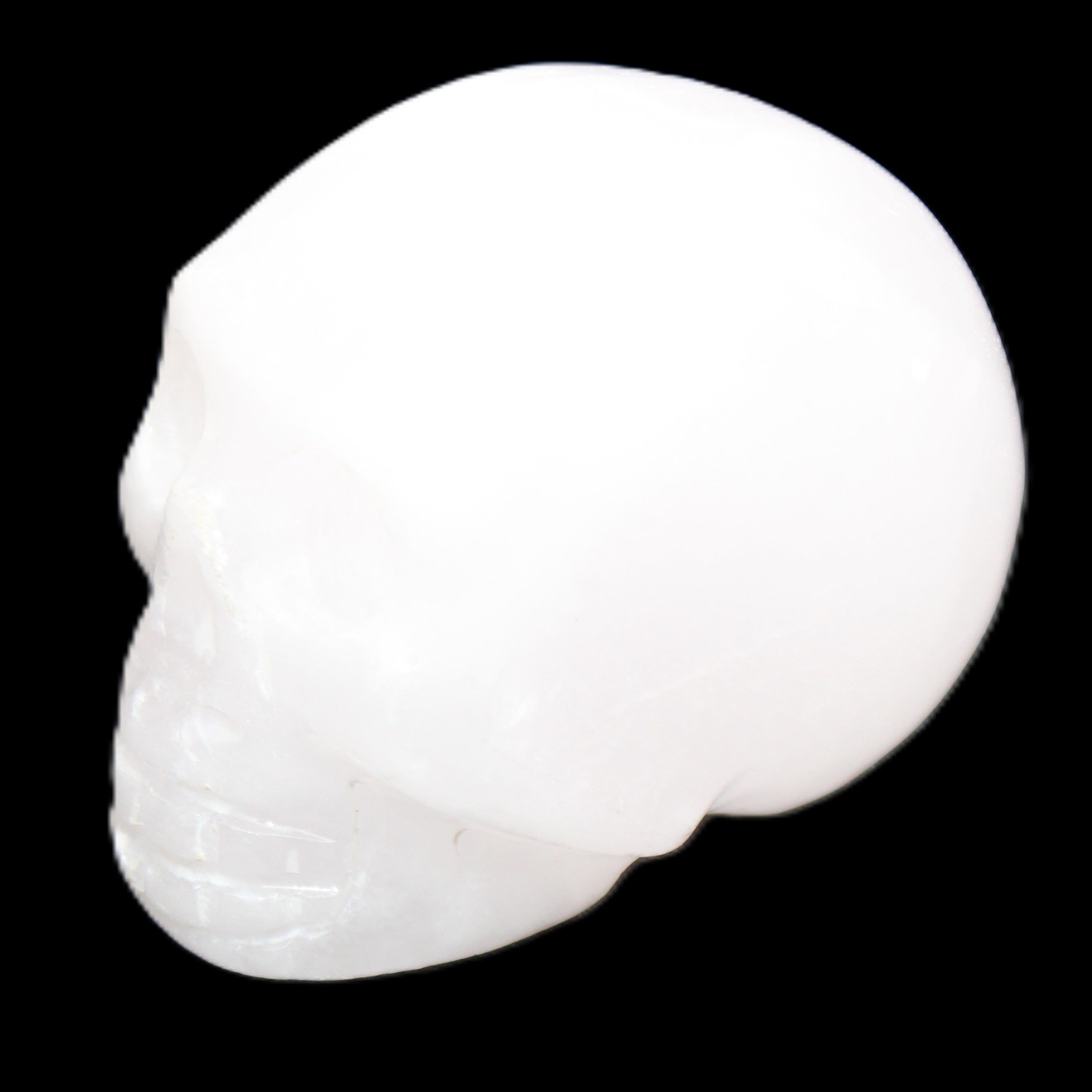 Mangano Calcite skull 32*45*38mm 87g in sunlight - Rocks and Things Store