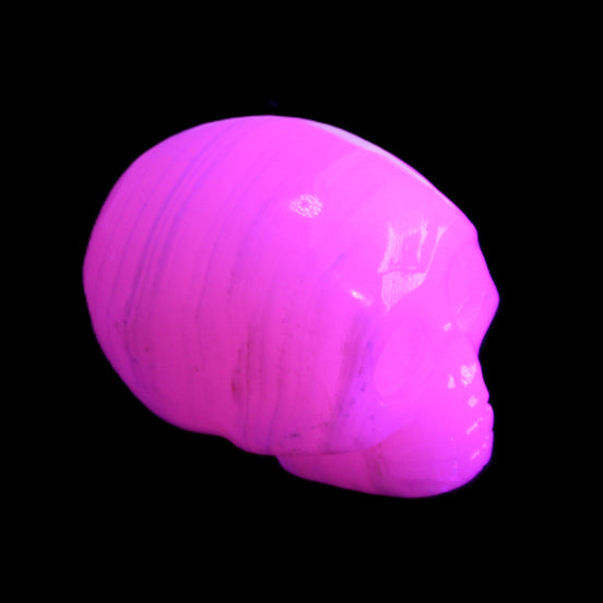 Mangano Calcite skull 28*45*35mm 81g in UV light - Rocks and Things Store