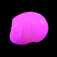 Mangano Calcite skull 28*45*35mm 81g in UV light - Rocks and Things Store