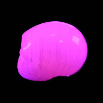 Mangano Calcite skull 28*45*35mm 81g in UV light - Rocks and Things Store
