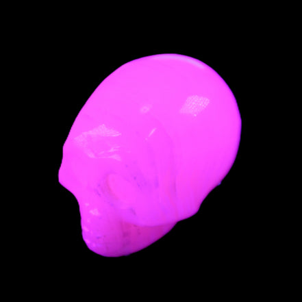 Mangano Calcite skull 28*45*35mm 81g in UV light - Rocks and Things Store