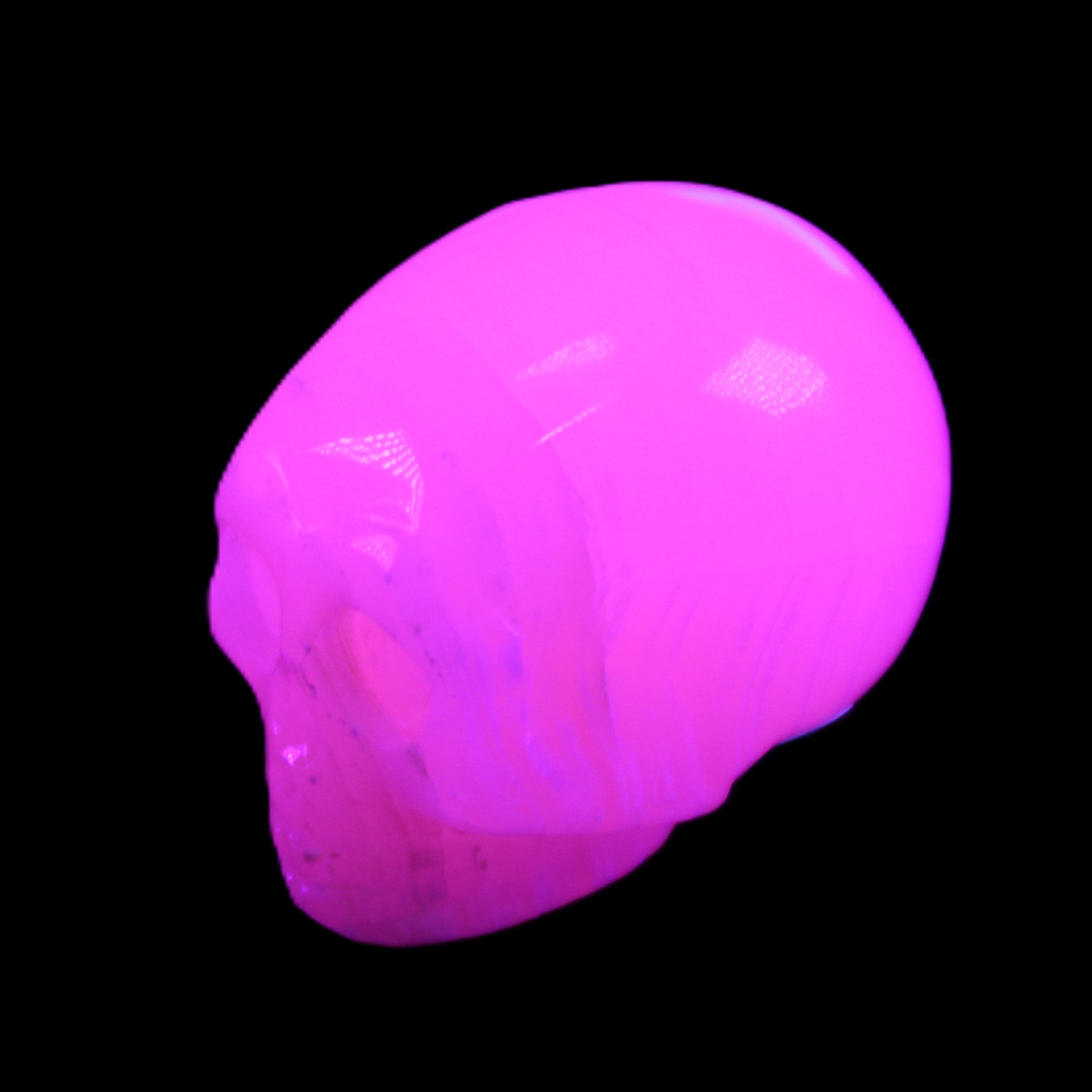 Mangano Calcite skull 28*45*35mm 81g in UV light - Rocks and Things Store