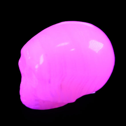 Mangano Calcite skull 28*45*35mm 81g in UV light - Rocks and Things Store