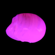 Mangano Calcite skull 28*45*35mm 81g in UV light - Rocks and Things Store