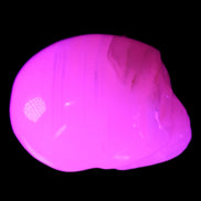Mangano Calcite skull 28*45*35mm 81g in UV light - Rocks and Things Store