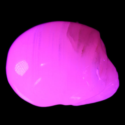 Mangano Calcite skull 28*45*35mm 81g in UV light - Rocks and Things Store