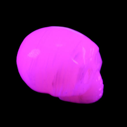 Mangano Calcite skull 28*45*35mm 81g in UV light - Rocks and Things Store