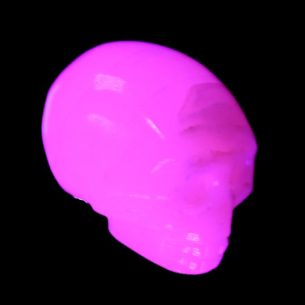 Mangano Calcite skull 28*45*35mm 81g in UV light - Rocks and Things Store