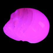 Mangano Calcite skull 28*45*35mm 81g in UV light - Rocks and Things Store