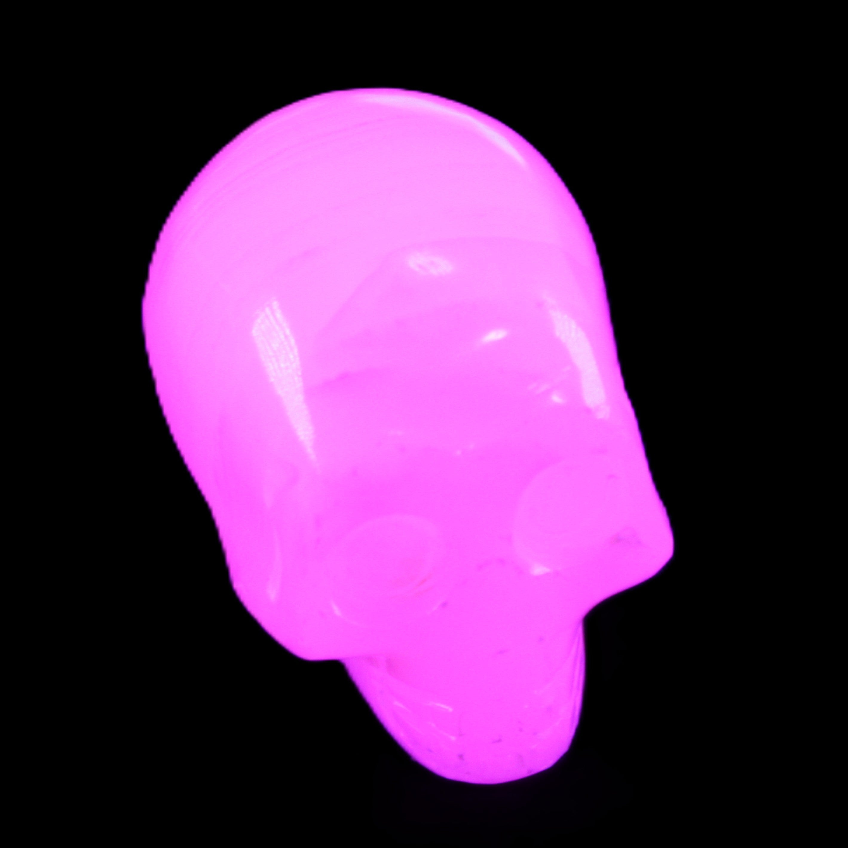 Mangano Calcite skull 28*45*35mm 81g in UV light - Rocks and Things Store