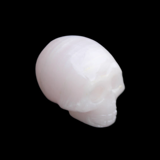 Mangano Calcite skull 28*45*35mm 81g in sunlight - Rocks and Things Store
