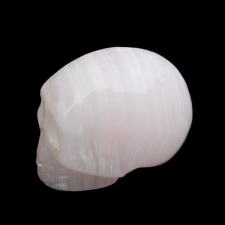 Mangano Calcite skull 28*45*35mm 81g in sunlight - Rocks and Things Store