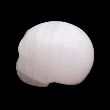 Mangano Calcite skull 28*45*35mm 81g in sunlight - Rocks and Things Store