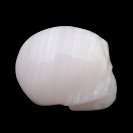 Mangano Calcite skull 28*45*35mm 81g in sunlight - Rocks and Things Store