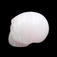 Mangano Calcite skull 28*45*35mm 81g in sunlight - Rocks and Things Store