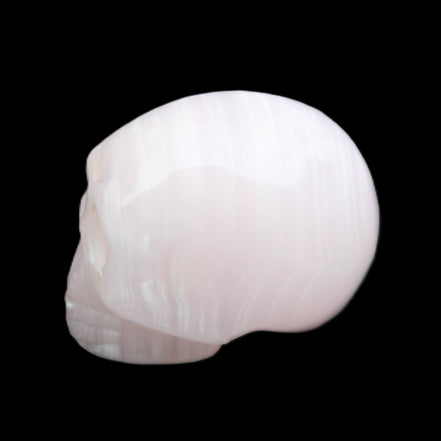 Mangano Calcite skull 28*45*35mm 81g in sunlight - Rocks and Things Store