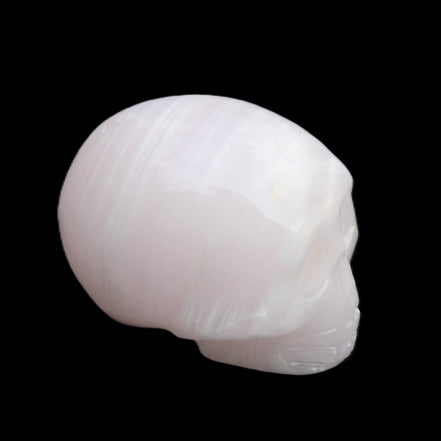Mangano Calcite skull 28*45*35mm 81g in sunlight - Rocks and Things Store