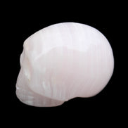 Mangano Calcite skull 28*45*35mm 81g in sunlight - Rocks and Things Store