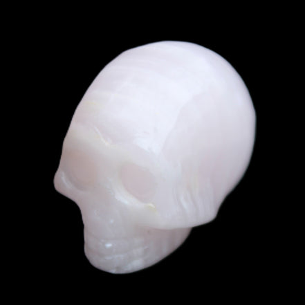 Mangano Calcite skull 28*45*35mm 81g in sunlight - Rocks and Things Store