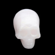 Mangano Calcite skull 28*45*35mm 81g in sunlight - Rocks and Things Store