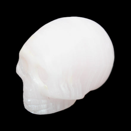 Mangano Calcite skull 28*45*35mm 81g in sunlight - Rocks and Things Store