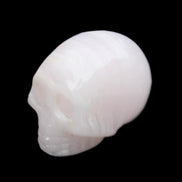 Mangano Calcite skull 28*45*35mm 81g in sunlight - Rocks and Things Store