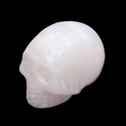Mangano Calcite skull 28*45*35mm 81g in sunlight - Rocks and Things Store
