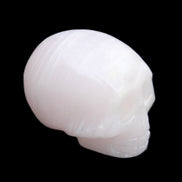 Mangano Calcite skull 28*45*35mm 81g in sunlight - Rocks and Things Store