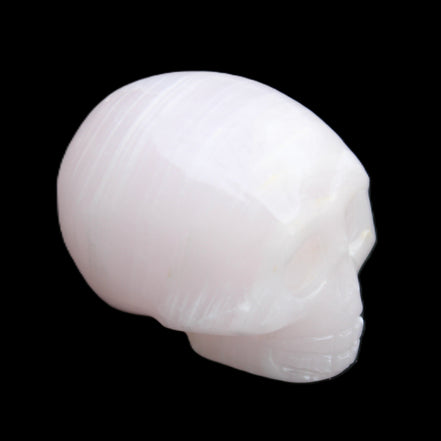 Mangano Calcite skull 28*45*35mm 81g in sunlight - Rocks and Things Store