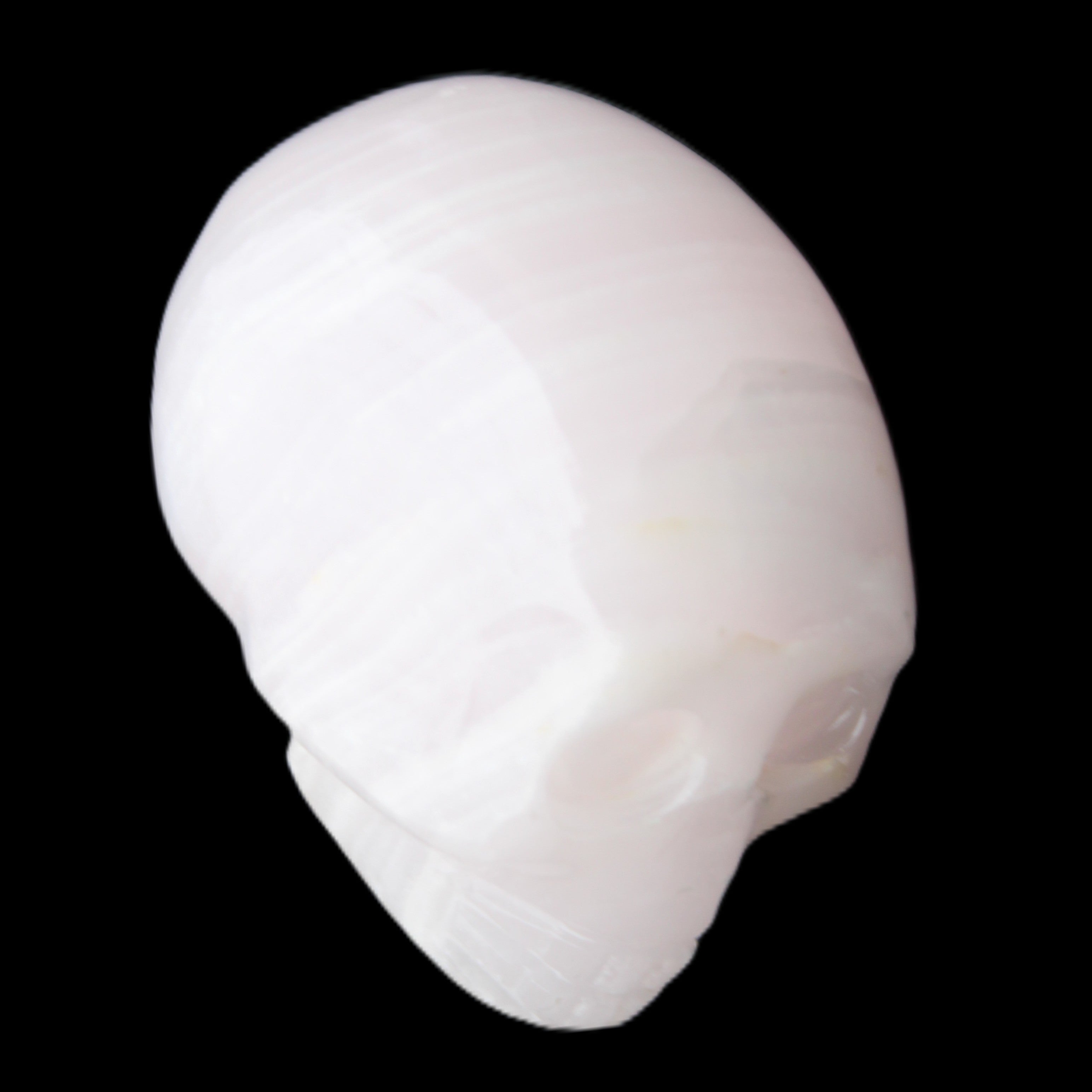 Mangano Calcite skull 28*45*35mm 81g in sunlight - Rocks and Things Store