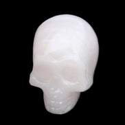 Mangano Calcite skull 28*45*35mm 81g in sunlight - Rocks and Things Store