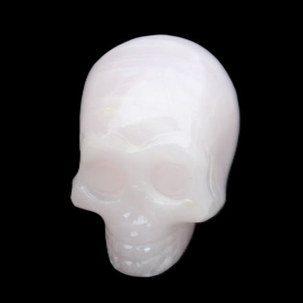 Mangano Calcite skull 28*45*35mm 81g in sunlight - Rocks and Things Store