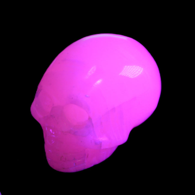 Mangano Calcite skull 30*47*35mm 81g in UV light - Rocks and Things Store