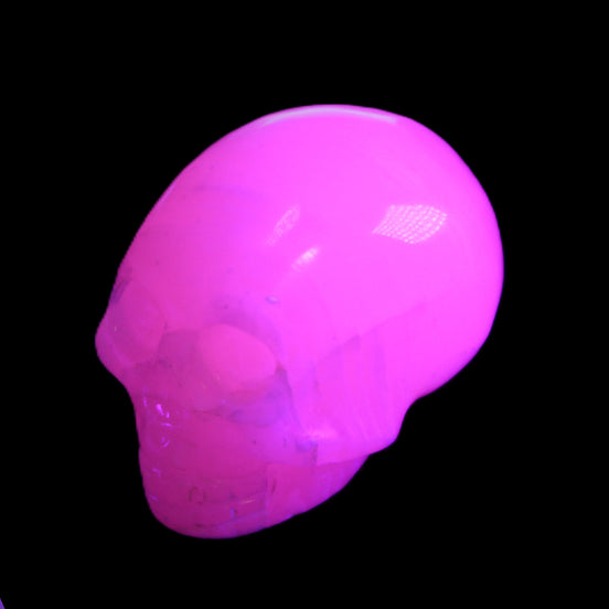 Mangano Calcite skull 30*47*35mm 81g in UV light - Rocks and Things Store