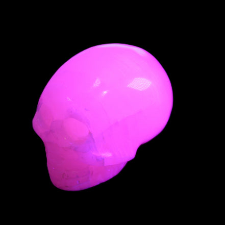 Mangano Calcite skull 30*47*35mm 81g in UV light - Rocks and Things Store