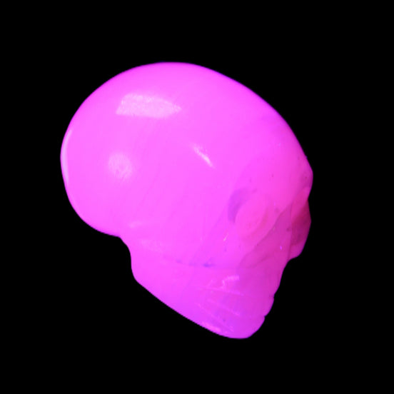 Mangano Calcite skull 30*47*35mm 81g in UV light - Rocks and Things Store