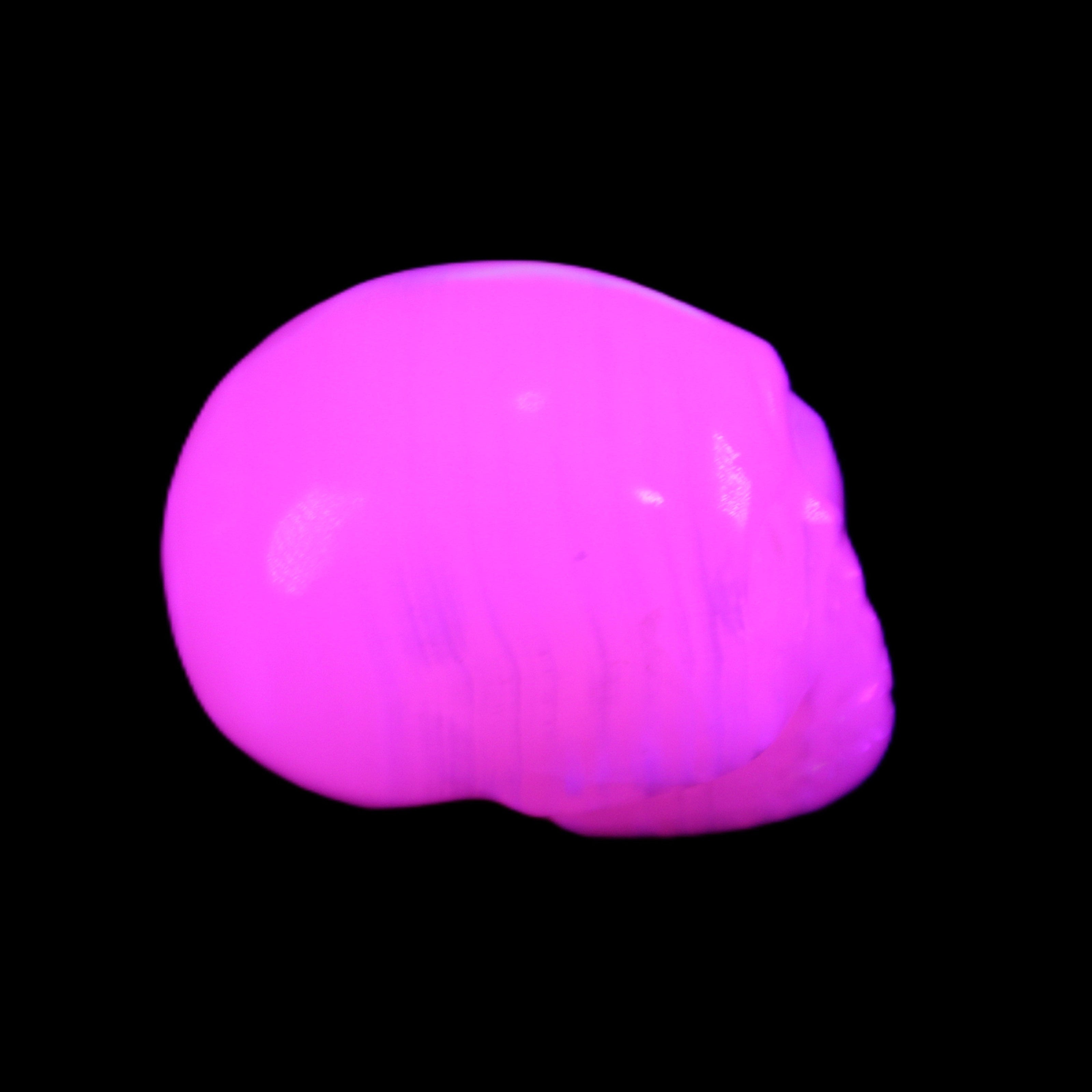 Mangano Calcite skull 30*47*35mm 81g in UV light - Rocks and Things Store