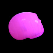 Mangano Calcite skull 30*47*35mm 81g in UV light - Rocks and Things Store