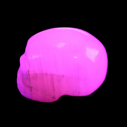 Mangano Calcite skull 30*47*35mm 81g in UV light - Rocks and Things Store