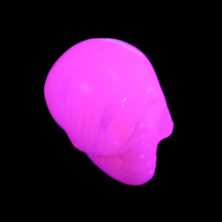 Mangano Calcite skull 30*47*35mm 81g in UV light - Rocks and Things Store