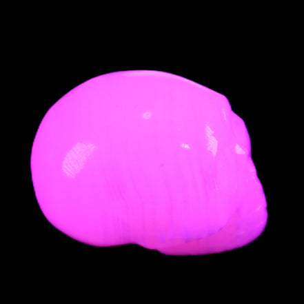 Mangano Calcite skull 30*47*35mm 81g in UV light - Rocks and Things Store