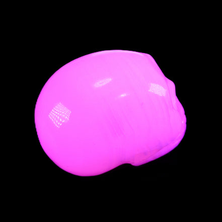 Mangano Calcite skull 30*47*35mm 81g in UV light - Rocks and Things Store