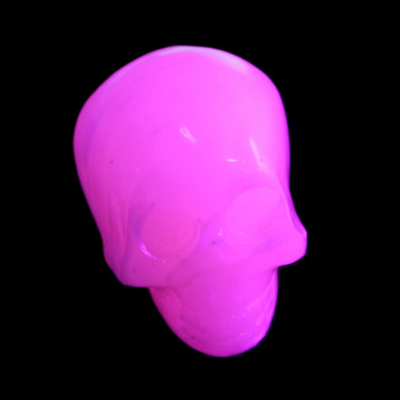 Mangano Calcite skull 30*47*35mm 81g in UV light - Rocks and Things Store