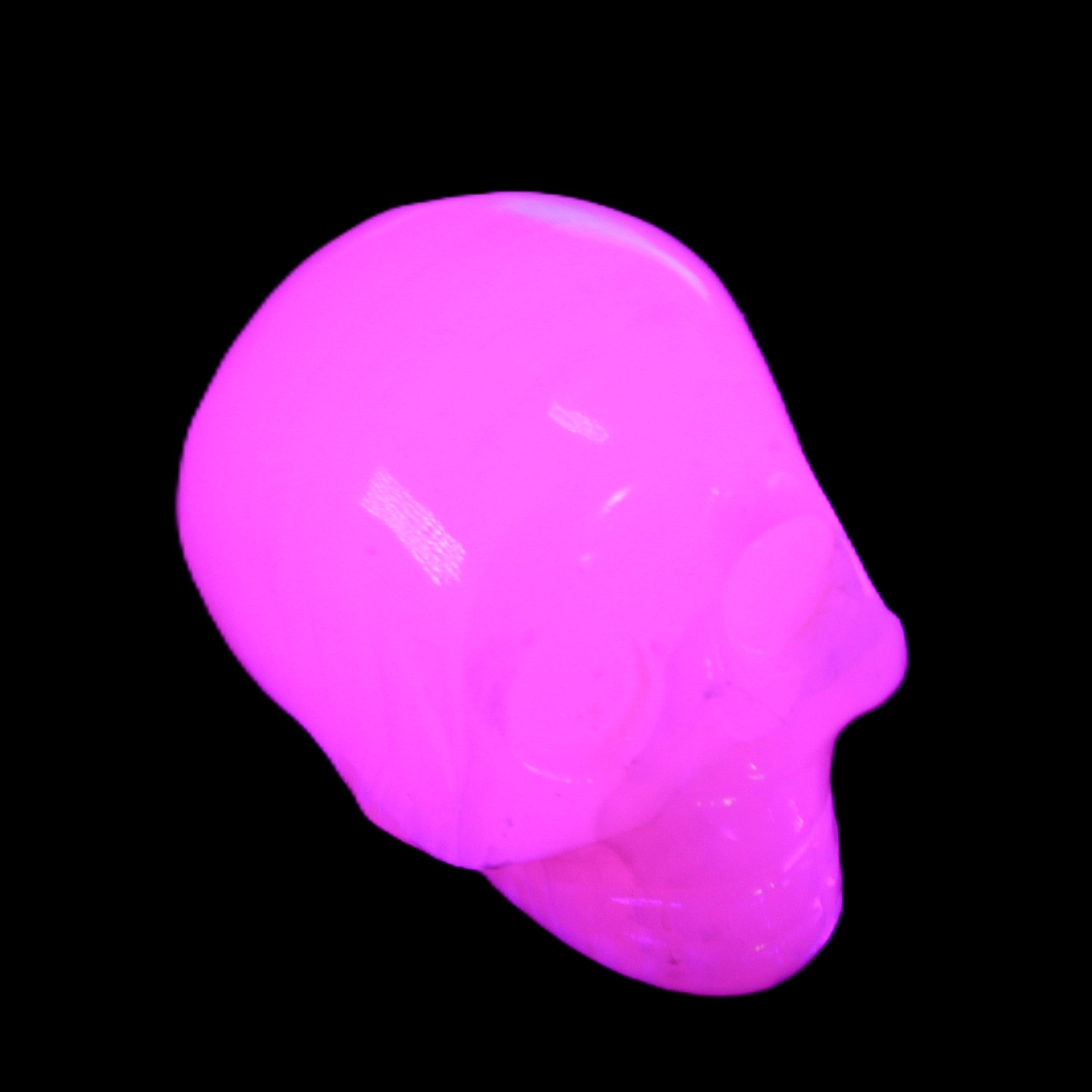 Mangano Calcite skull 30*47*35mm 81g in UV light - Rocks and Things Store