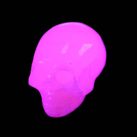 Mangano Calcite skull 30*47*35mm 81g in UV light - Rocks and Things Store