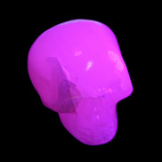 Mangano Calcite skull 45*60*57mm 199g in UV light - Rocks and Things Store