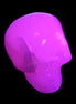 Mangano Calcite skull 45*60*57mm 199g in UV light - Rocks and Things Store
