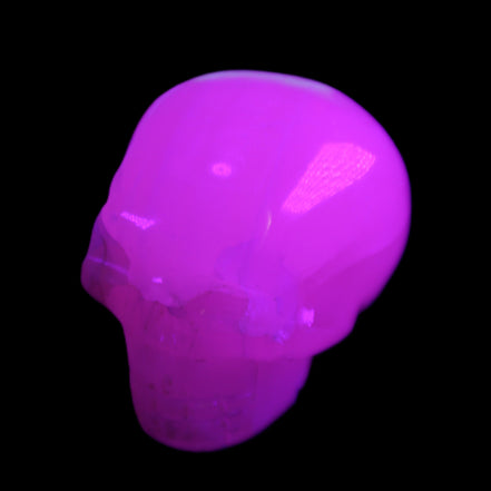 Mangano Calcite skull 45*60*57mm 199g in UV light - Rocks and Things Store