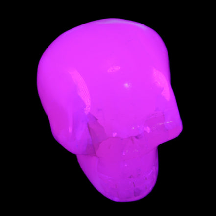 Mangano Calcite skull 45*60*57mm 199g in UV light - Rocks and Things Store